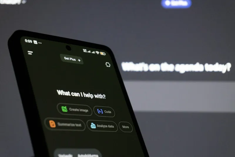 A phone showing an AI assistant asking how it can help