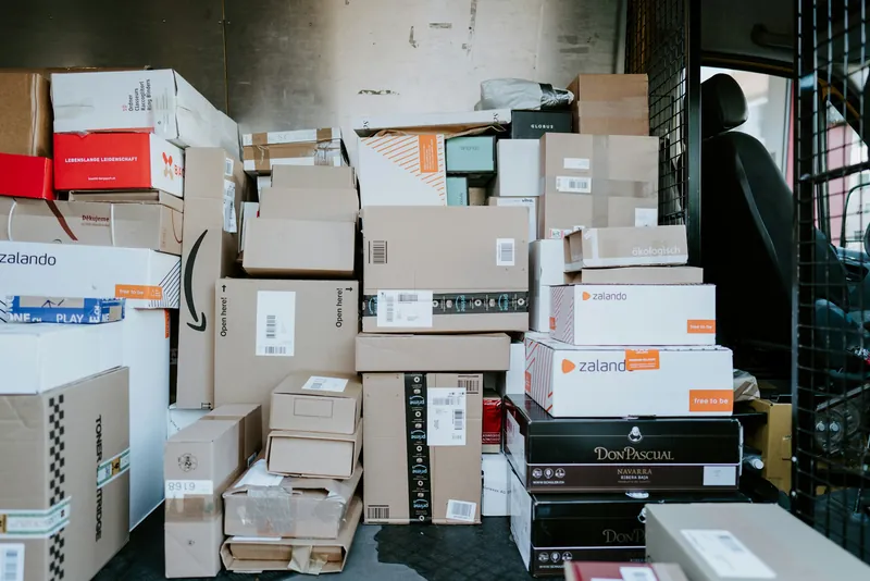 A room full of stacked boxes and parcels